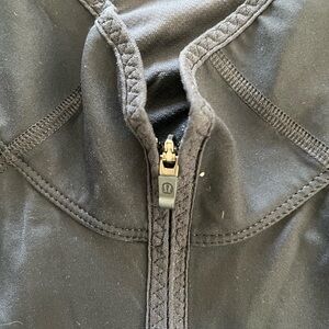 Lululemon black activewear long sleeve zip top. Size 10.